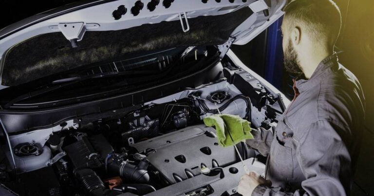 A mechanic doing regular car maintenance at Xpress Auto Care, Carrollton, TX