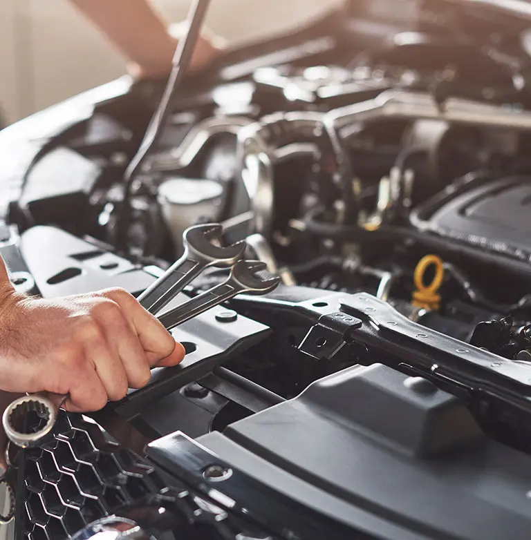 mechanic doing routine car maintenance